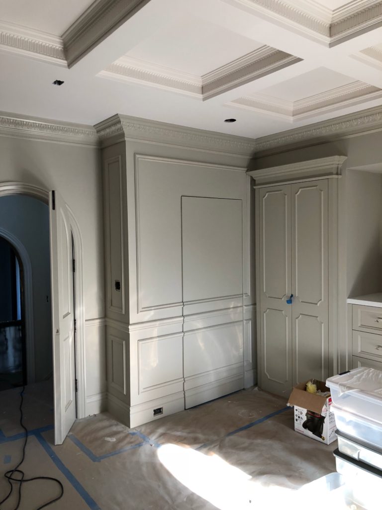 Coffered ceiling, wall frames, crown moulding and one of a kind casing