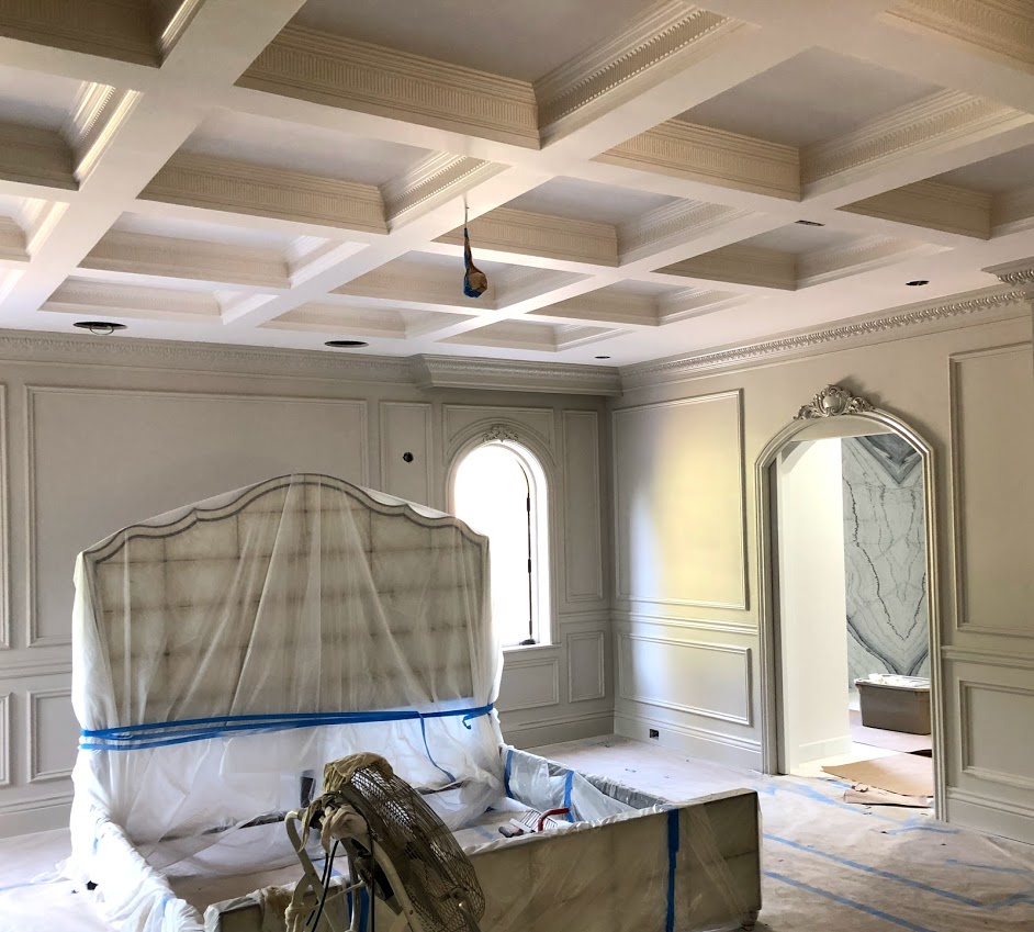 Coffered ceiling, wall frames, crown moulding and one of a kind casing